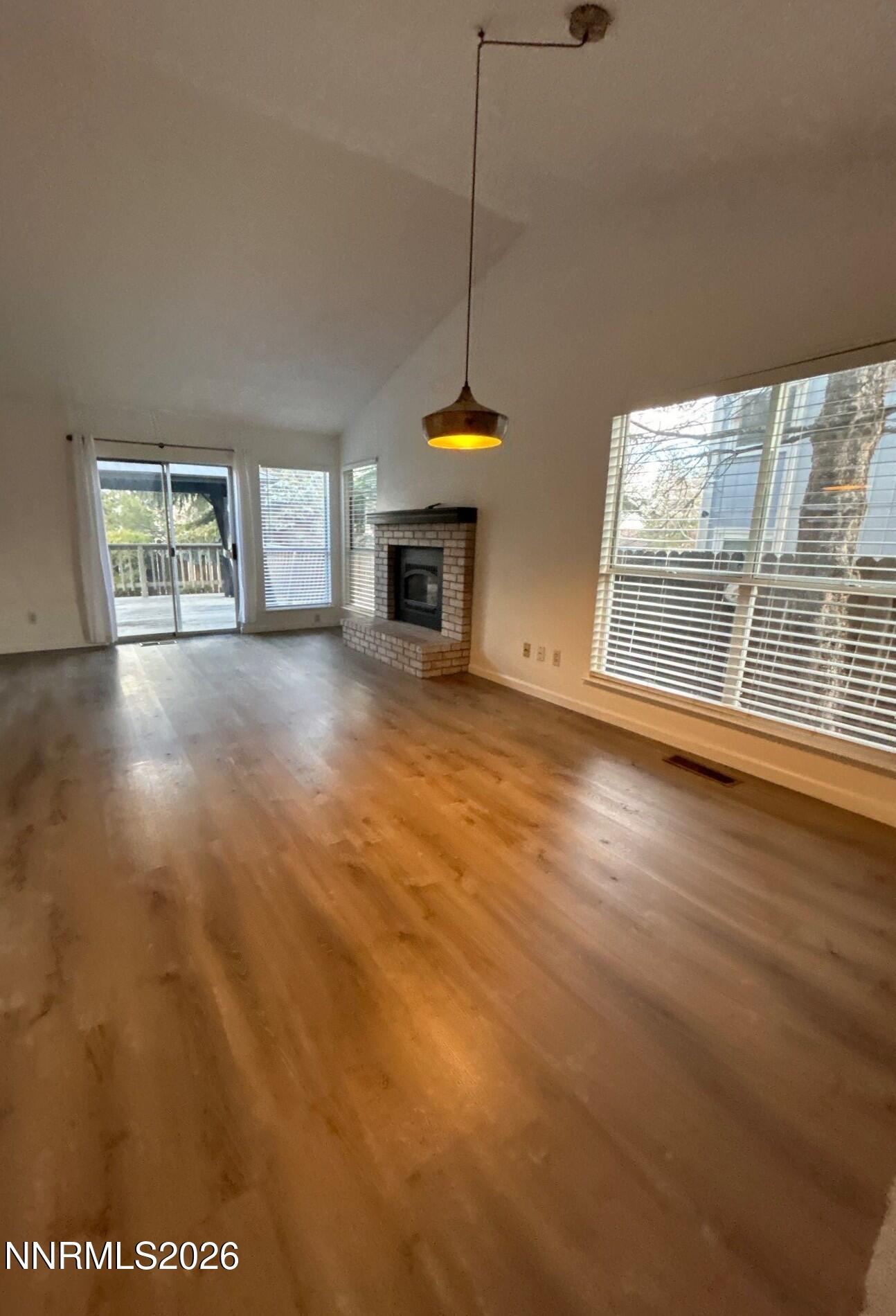 4771 Amber Hill Lane Reno, NV 89523 - Photo 2 of 20 a view of an empty room with a window and fireplace