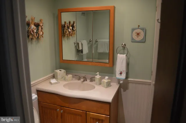 a bathroom with a sink and mirror