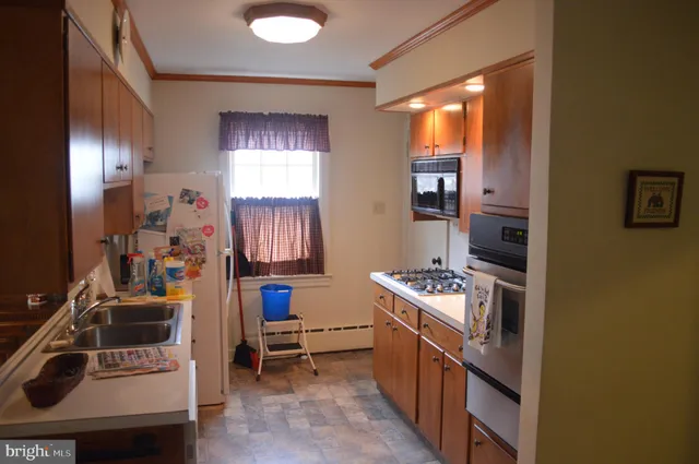 a kitchen with a stove and a sink