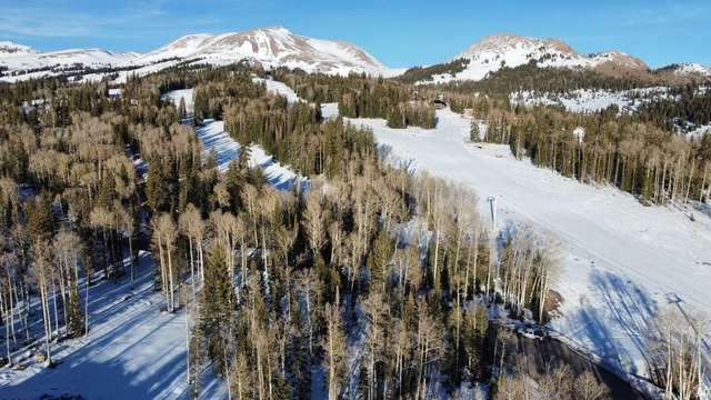 6 Tushar Mountain Estates, Unit 6 Beaver, UT 84713 - Photo 16 of 16 Expansive winter landscape featuring snow-covered mountain slopes, evergreen trees, and bare deciduous trees