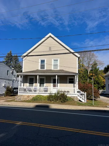 a front view of a house with swimming pool