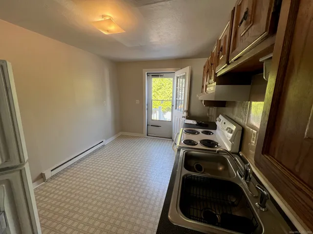 a kitchen with a stove and a microwave