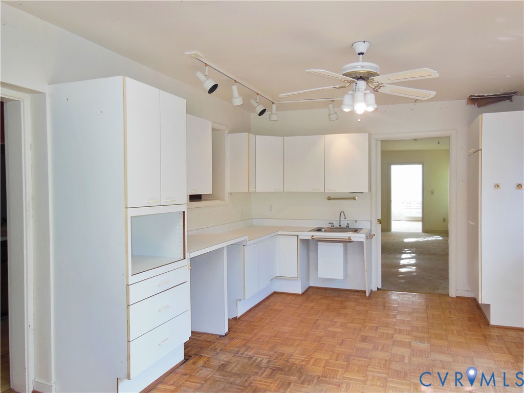 8218 Overbury Road Richmond, VA 23227 - Photo 11 of 37 a view of a kitchen with a sink and cabinet area