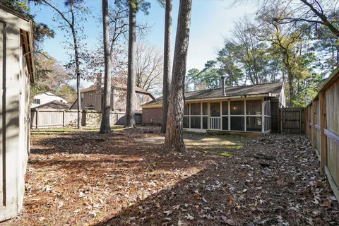 a view of a house with trees in the background