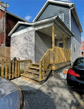 a view of a house with a yard