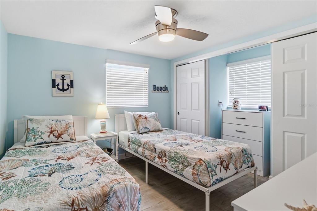 6154 Midnight Pass Road, Unit A05 Sarasota, FL 34242 - Photo 17 of 39 a bedroom with a bed and a dresser