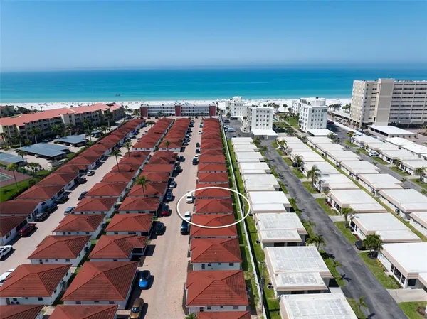 an aerial view of residential building and ocean view