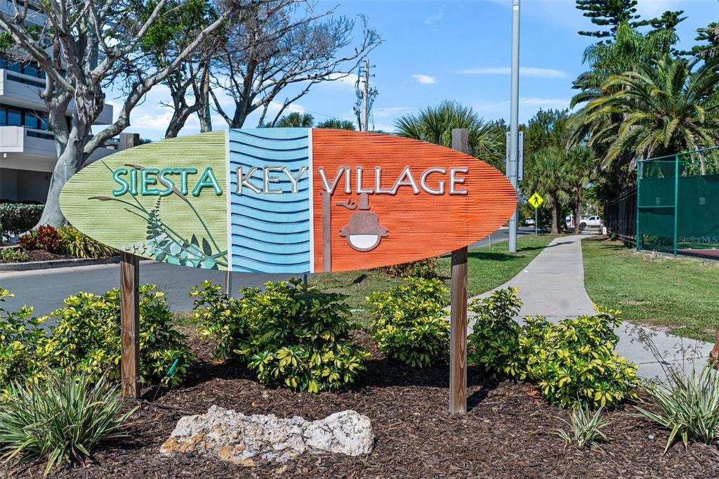 6154 Midnight Pass Road, Unit A05 Sarasota, FL 34242 - Photo 35 of 39 a sign on the side of the road