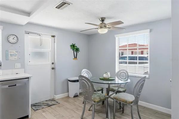 a view of a dining room with furniture window and wooden floor