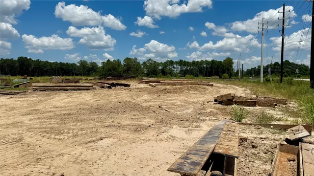 a view of backyard with swimming pool