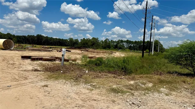 a view of a swimming pool and a yard