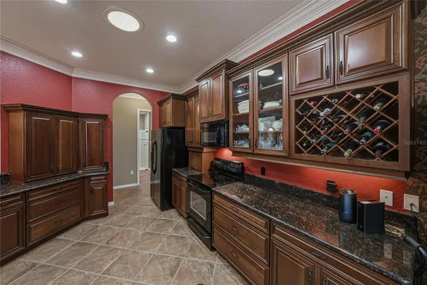 a bed room with a bed and a large window