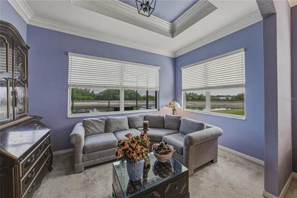 a view of a chair and tables in the patio