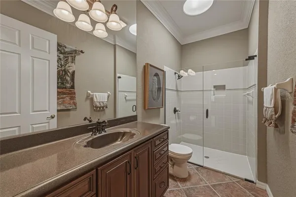 an aerial view of a house with a lake view