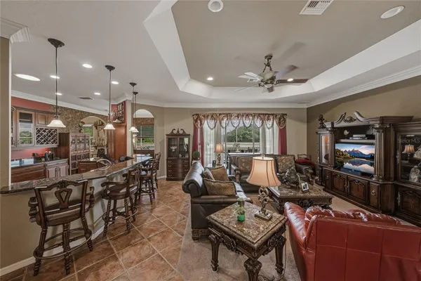 a view of a dining area with furniture and chandelier