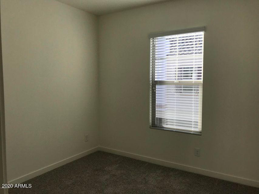 4038 East Erie Street, Unit 101 Gilbert, AZ 85295 - Photo 6 of 7 an empty room with a window