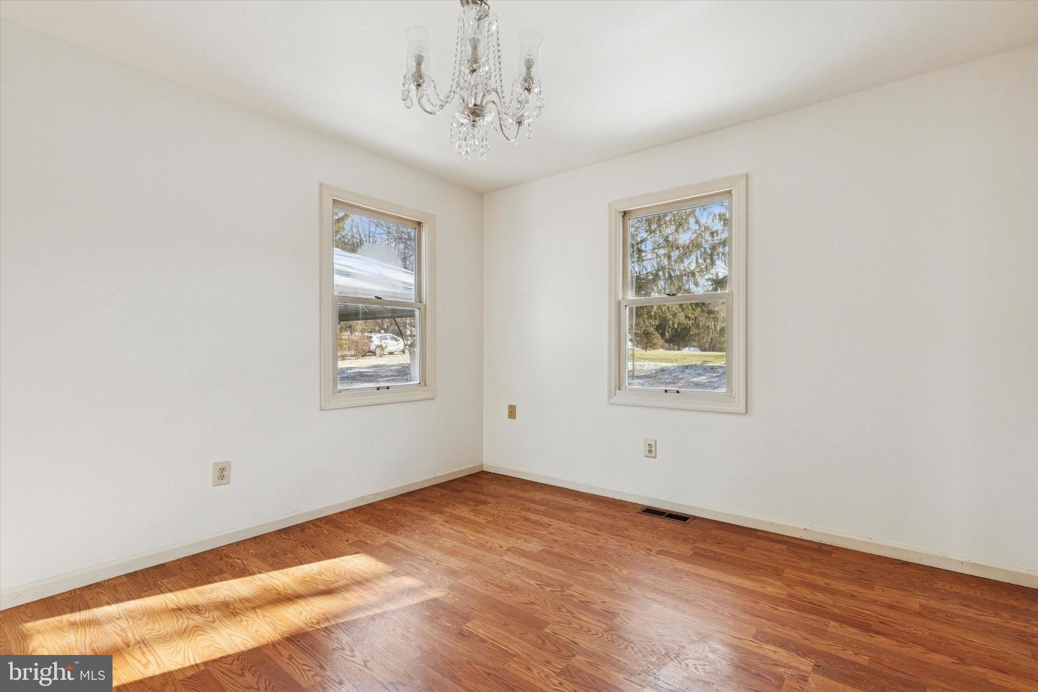 257 Mingo Road Royersford, PA 19468 - Photo 16 of 31 a view of an empty room with wooden floor and a window