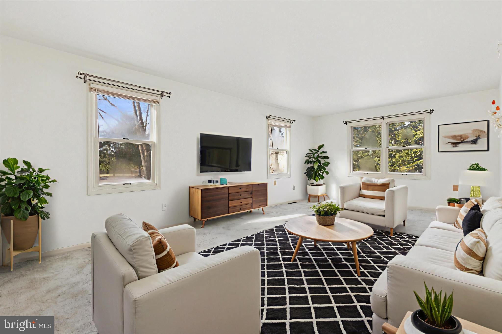 257 Mingo Road Royersford, PA 19468 - Photo 3 of 31 a living room with furniture a window and a flat screen tv