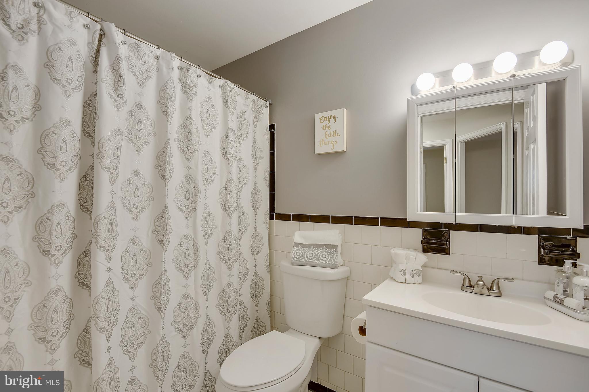 8615 Emory Grove Road Gaithersburg, MD 20877 - Photo 15 of 27 Classic Black and White Bathroom