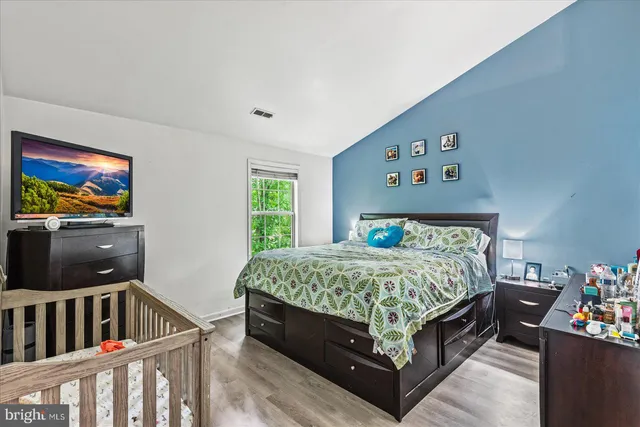 a bathroom with a sink mirror and toilet