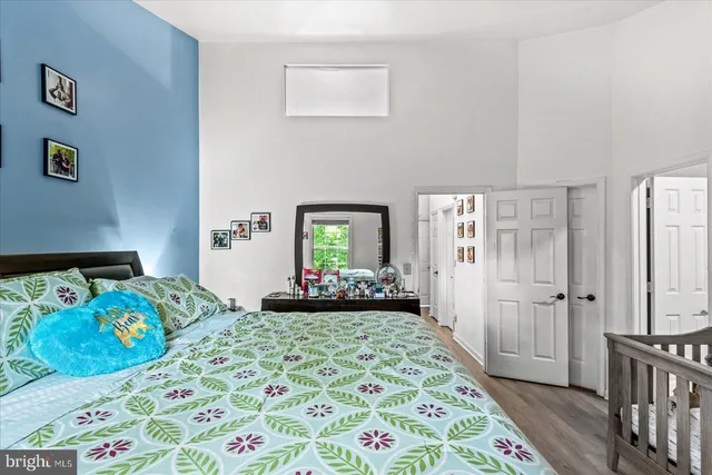 a bedroom with furniture and a window