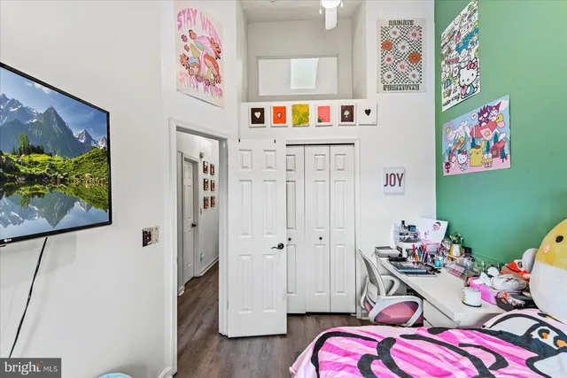 a living room with furniture and stairs