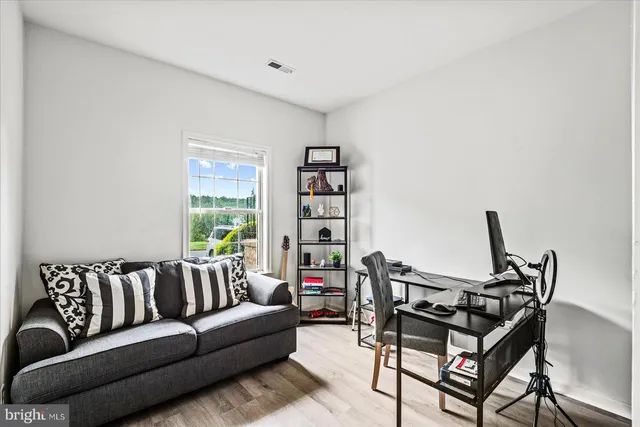 a backyard of a house with lots of green space and plants