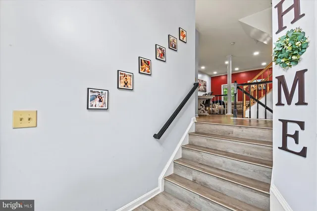 a kitchen with stainless steel appliances a stove a sink and a refrigerator