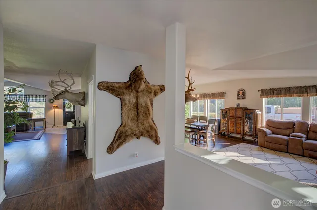 a living room with furniture and a gym equipment