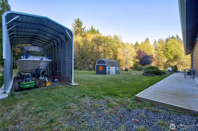 a view of a chair and table in the yard