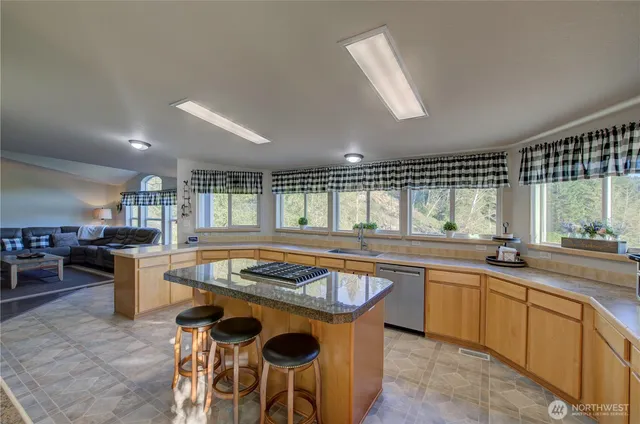a kitchen with a sink stove and cabinets