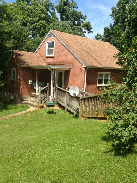 144 Woodcott Road Ferrum, VA 24088 - Photo 3 of 21 a backyard of a house with table and chairs