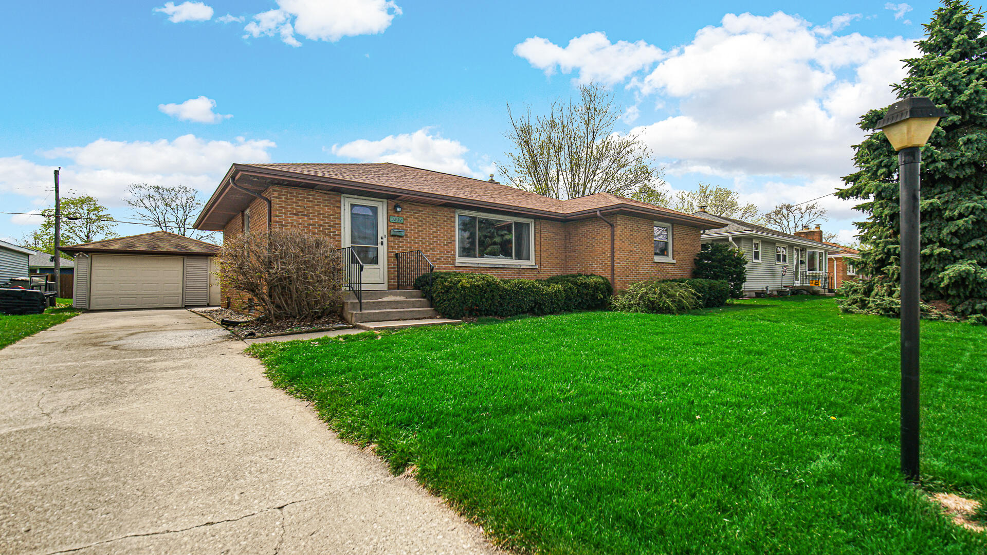 3232 Laporte Street Highland, IN 46322 - Photo 2 of 26 a view of a house with yard and a garden