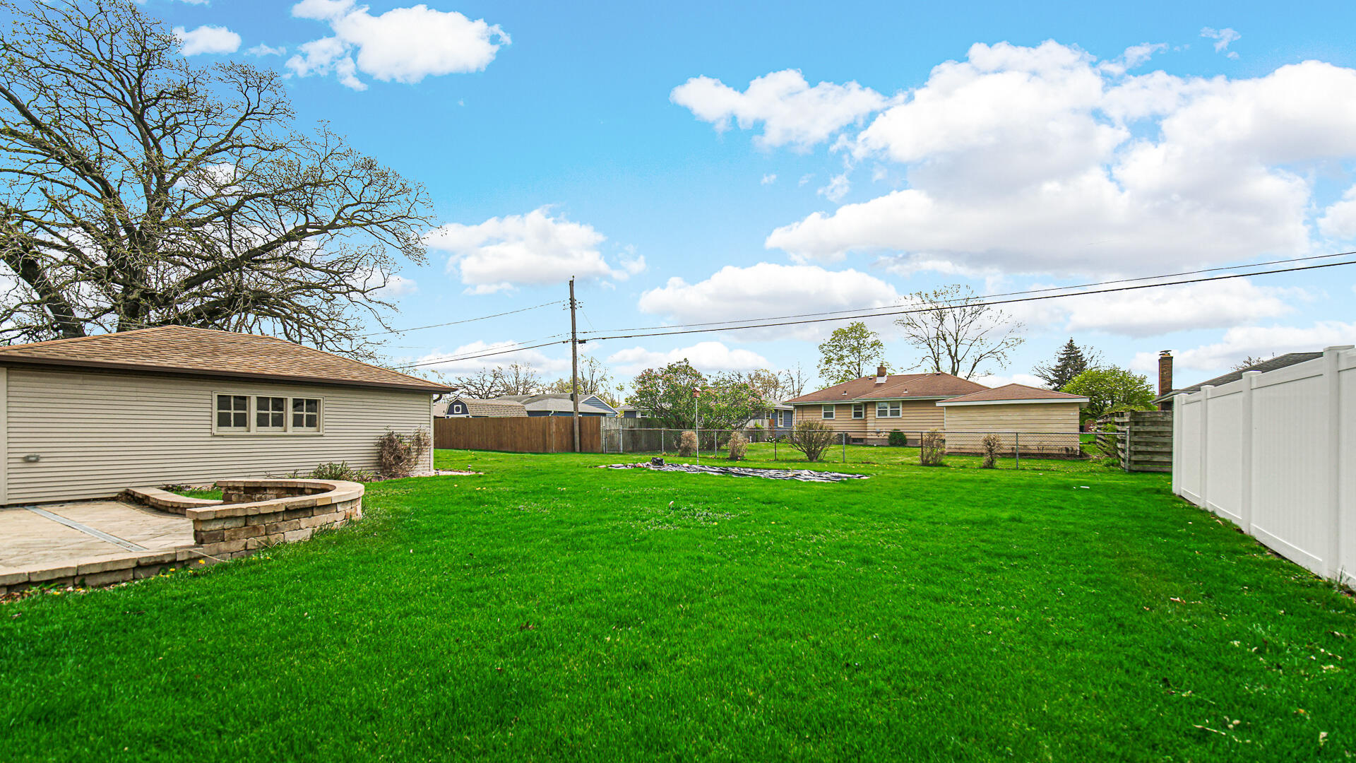3232 Laporte Street Highland, IN 46322 - Photo 25 of 26 a backyard of a house with table and chairs