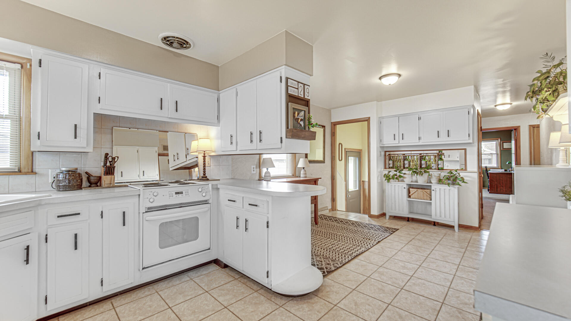 3232 Laporte Street Highland, IN 46322 - Photo 8 of 26 a kitchen with white cabinets and white appliances