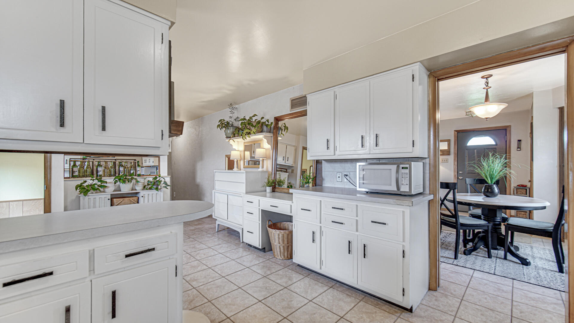 3232 Laporte Street Highland, IN 46322 - Photo 10 of 26 a kitchen with white cabinets and window