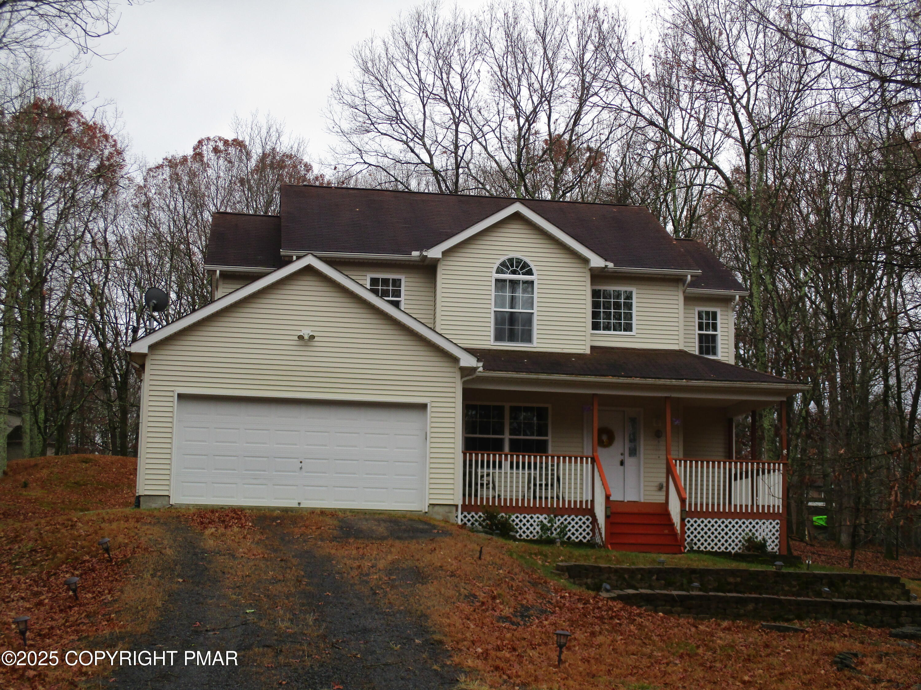 3290 Bluebird Drive Bushkill, PA 18324 - Photo 1 of 19 a front view of a house with garden