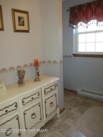 a kitchen with a stove and a white cabinet