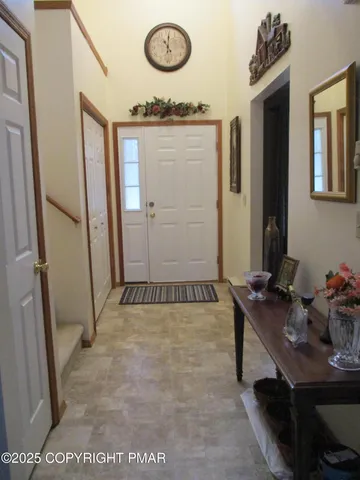 a view of a livingroom with furniture and hardwood floor