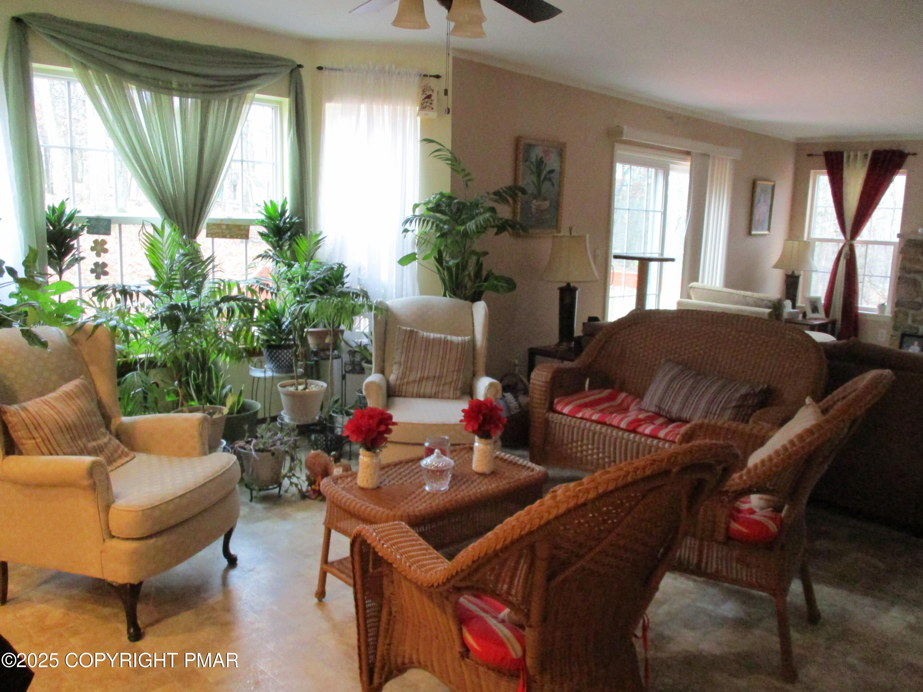 3290 Bluebird Drive Bushkill, PA 18324 - Photo 7 of 19 a living room with furniture and a potted plant