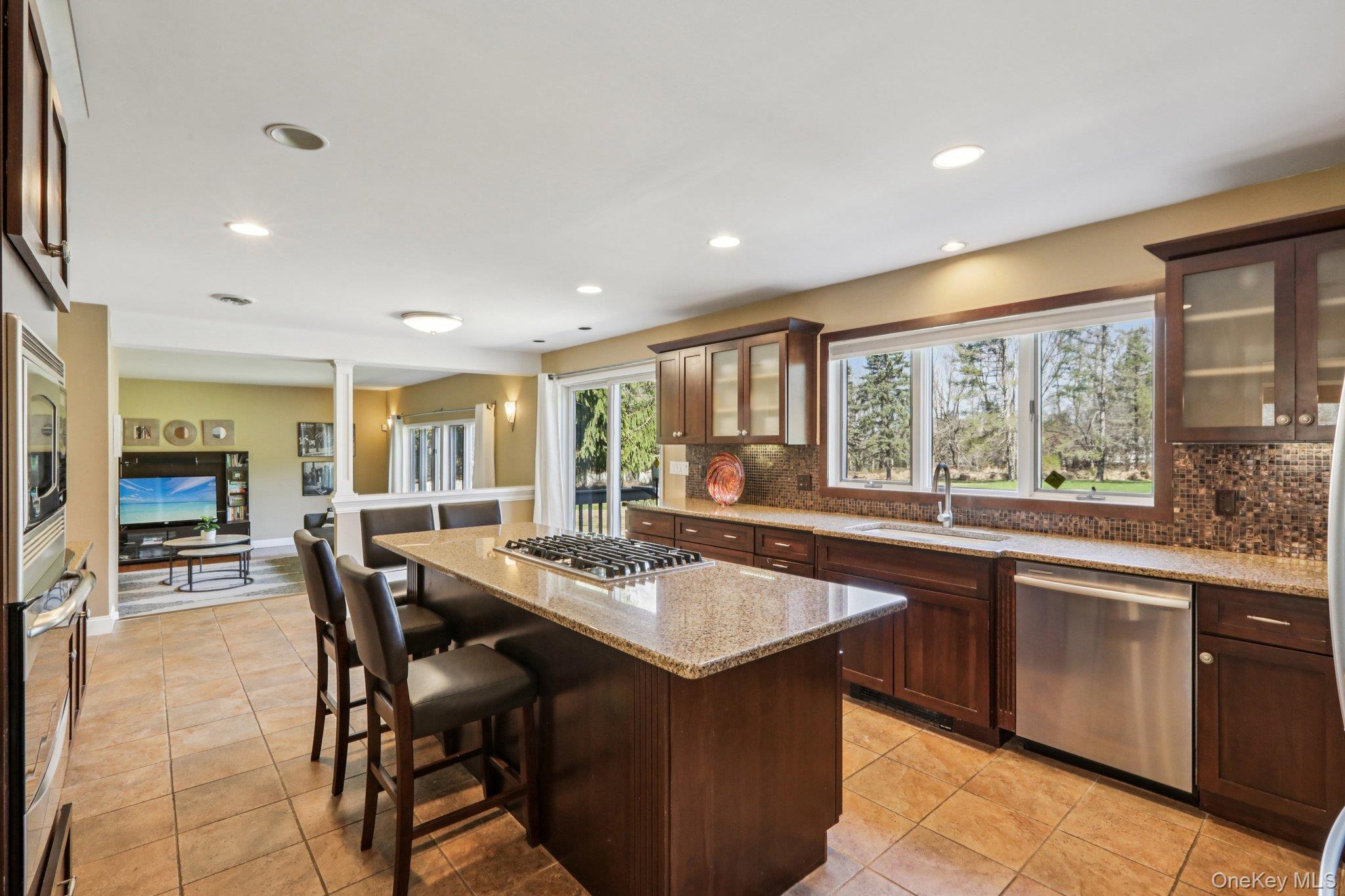 76 Waterbury Road Warwick, NY 10990 - Photo 18 of 46 This chefs kitchen is appointed with granite counter tops and gleaming stainless steel appliances.