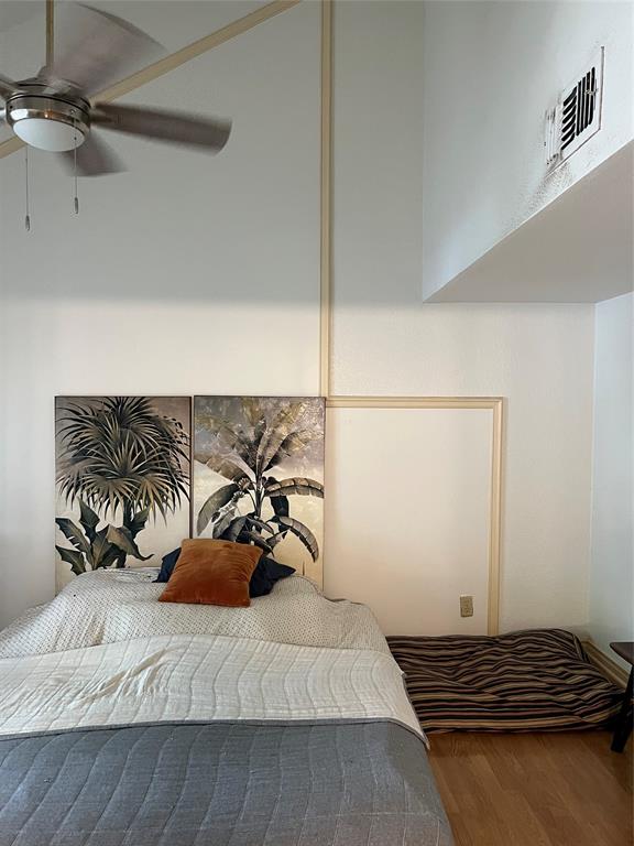 1522 Signal Ridge Place, Unit 1522 Rockwall, TX 75032 - Photo 14 of 28 a bedroom with a bed and dresser