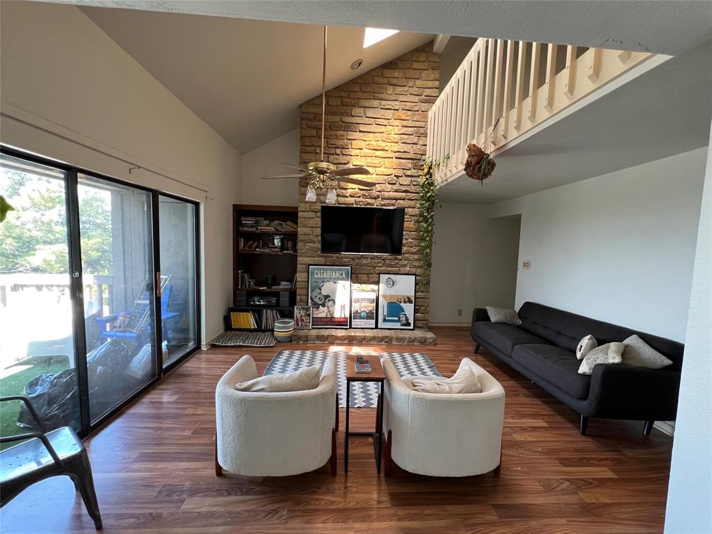 1522 Signal Ridge Place, Unit 1522 Rockwall, TX 75032 - Photo 2 of 28 a living room with furniture and a flat screen tv