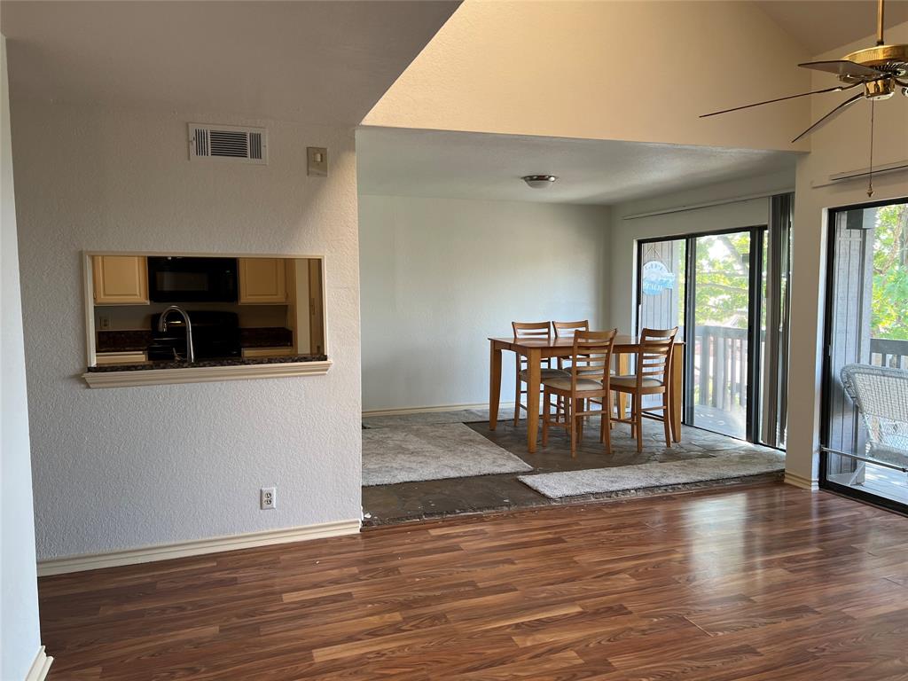 1522 Signal Ridge Place, Unit 1522 Rockwall, TX 75032 - Photo 4 of 28 a view of a livingroom with furniture and wooden floor