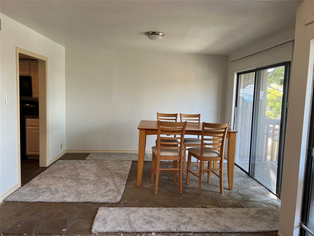 1522 Signal Ridge Place, Unit 1522 Rockwall, TX 75032 - Photo 5 of 28 a dining room with furniture and window