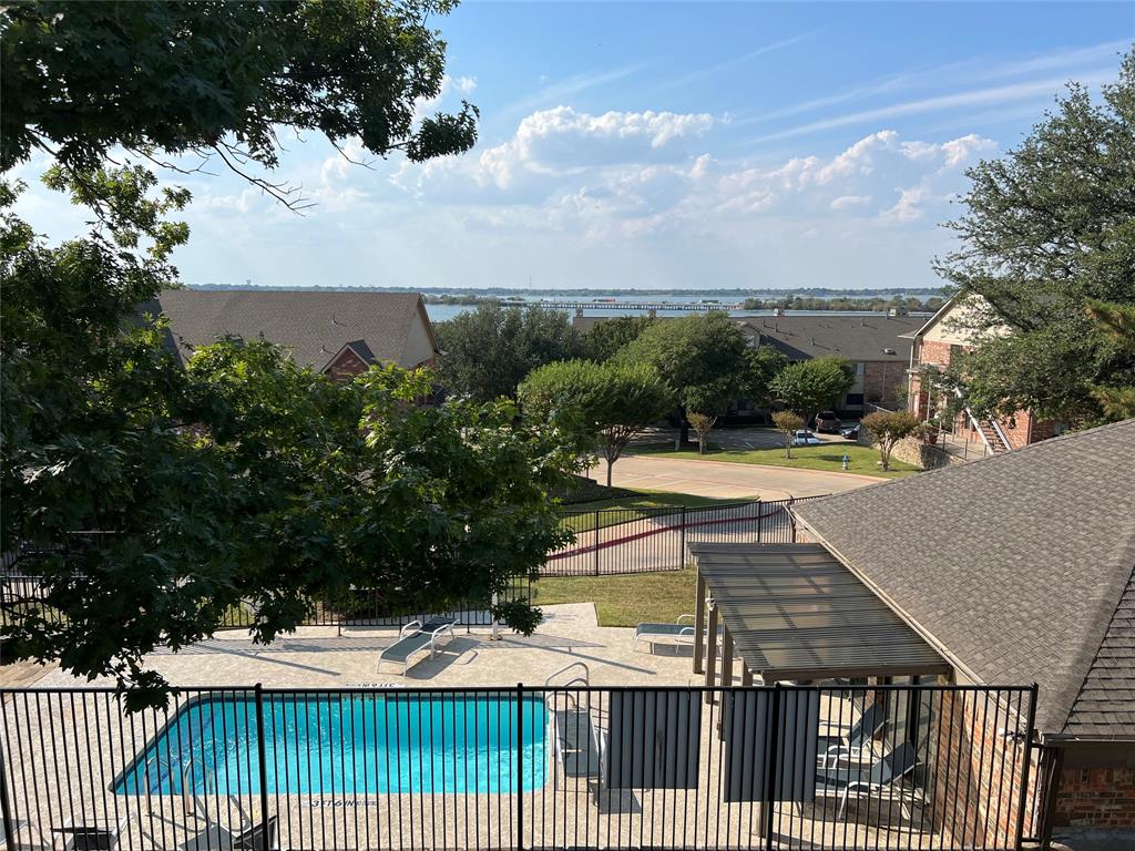 1522 Signal Ridge Place, Unit 1522 Rockwall, TX 75032 - Photo 6 of 28 a view of a swimming pool with a patio