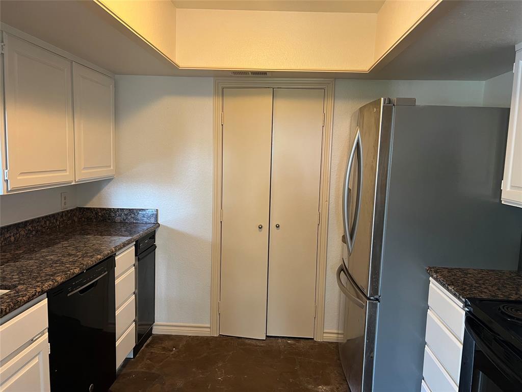 1522 Signal Ridge Place, Unit 1522 Rockwall, TX 75032 - Photo 8 of 28 a kitchen with stainless steel appliances granite countertop a refrigerator and a sink