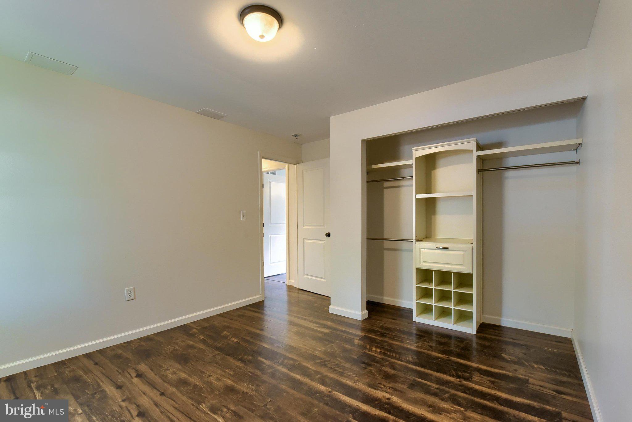 3740 Beagle Road Middletown, PA 17057 - Photo 16 of 70 an empty room with wooden floor and windows