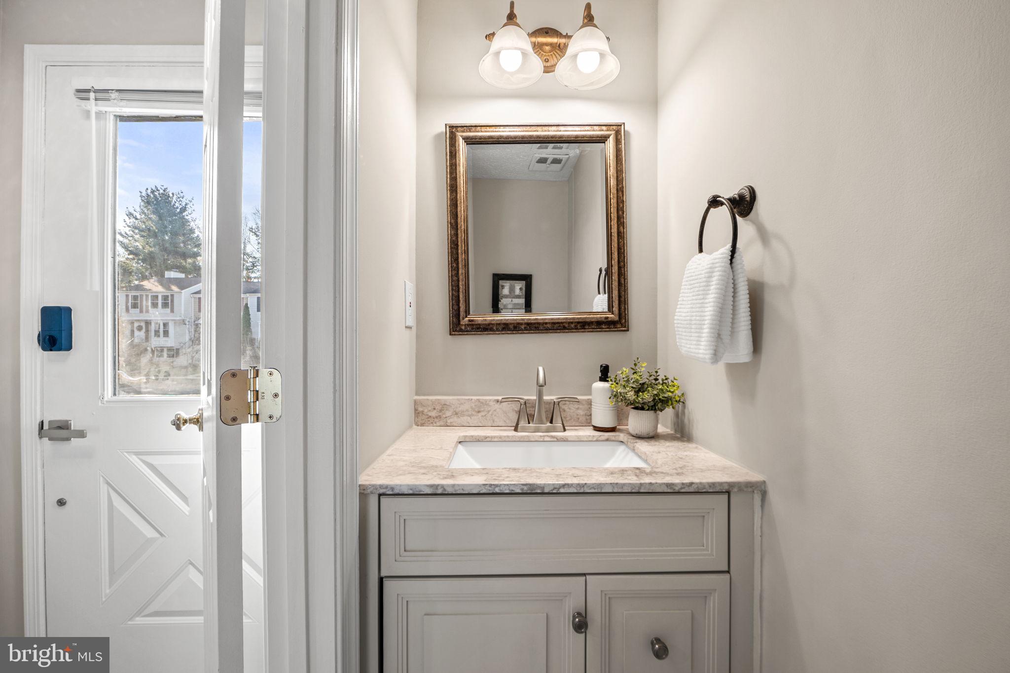 1747 Sundance Drive Reston, VA 20194 - Photo 12 of 36 a bathroom with a sink vanity and a mirror