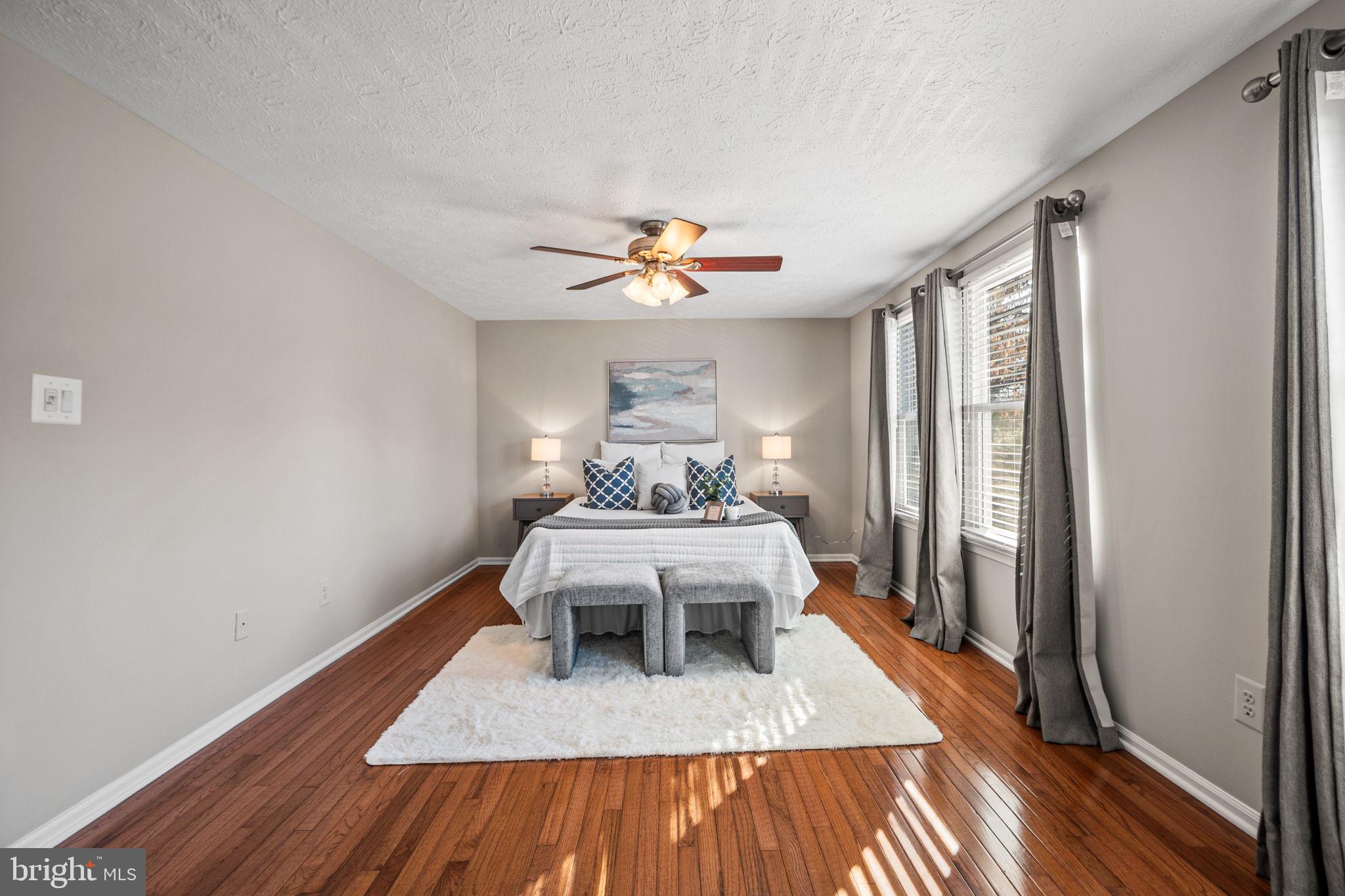 1747 Sundance Drive Reston, VA 20194 - Photo 16 of 36 a living room with furniture and a wooden floor